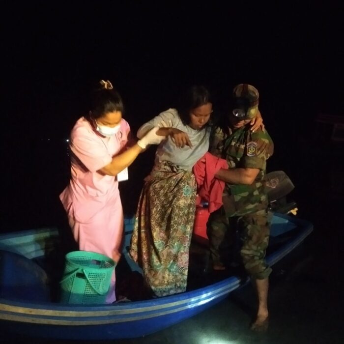 Thlang Sotheavy (left) assisted Un Theda (center), who gave birth to her son on a boat while traveling to the hospital.