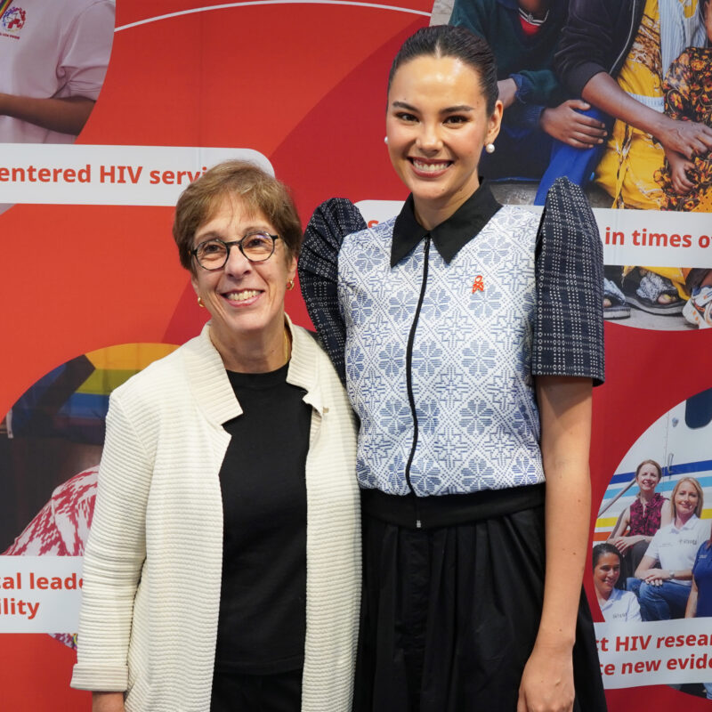 FHI 360 smiling at left posing with Catriona Gray